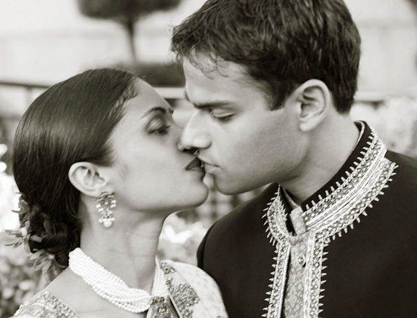 photo by New York based wedding photographer Merri Cry - happy couple embraced in a kiss - indian wedding 